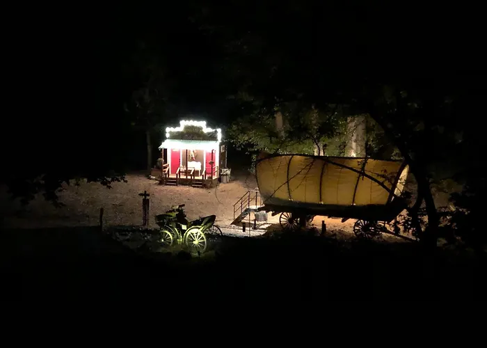 Cozy Wild West Covered Wagon Next To River