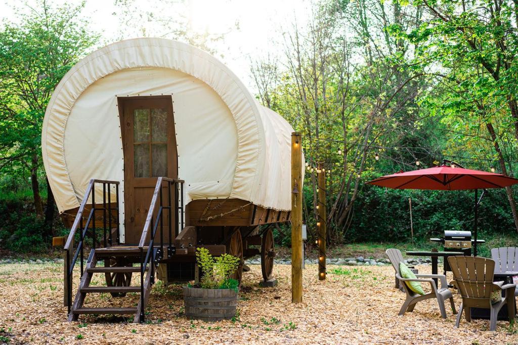 Cozy Wild West Covered Wagon Next To River