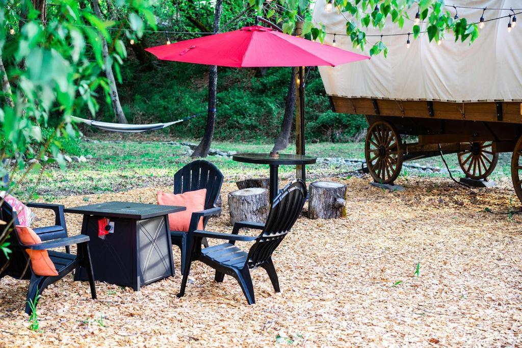 Luxury tent Cozy Wild West Covered Wagon Next To River *