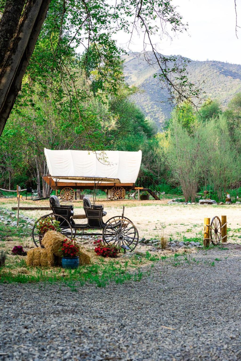 Cozy Wild West Covered Wagon Next To River Luxury tent *