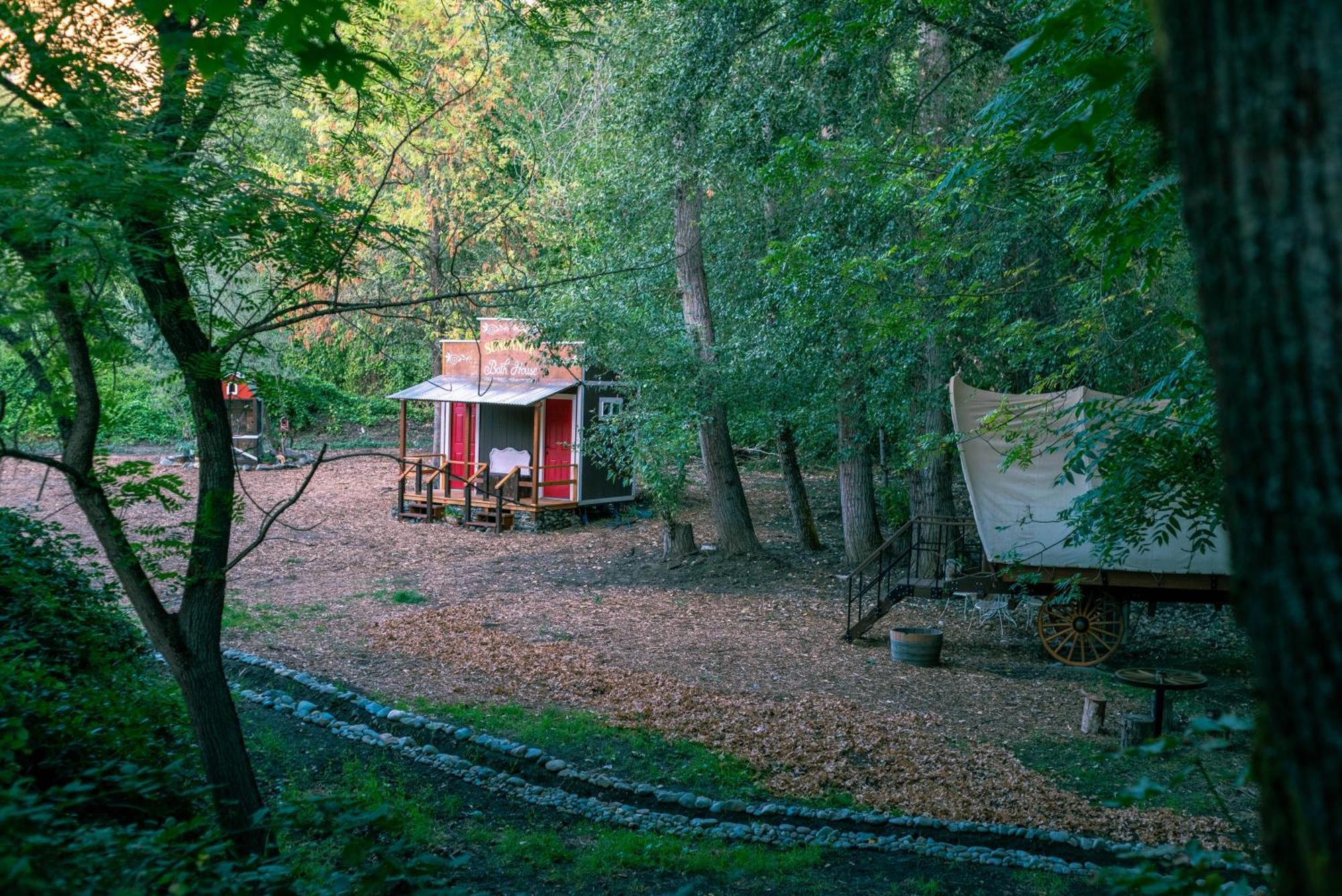 Cozy Wild West Covered Wagon Next To River *